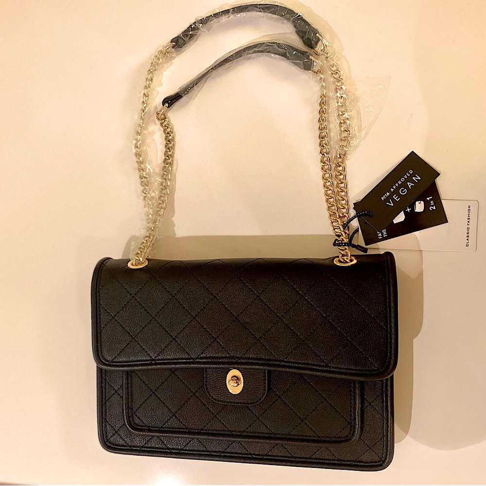 Black vegan leather quilted handbag w/gold chain straps & matching wallet.
